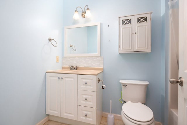 232 Mill Pond Dr, Phenix City, AL 36870 - bathroom featuring vanity, tasteful backsplash, toilet, and baseboards