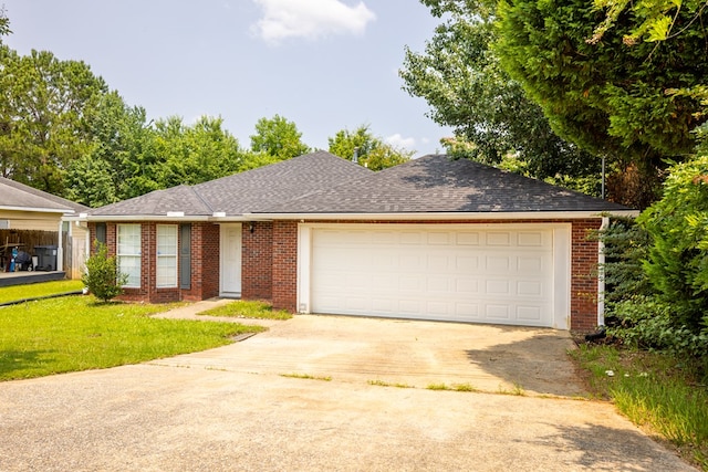 232 Mill Pond Dr, Phenix City, AL 36870 - ranch-style home with concrete driveway, brick siding, a garage, and a front yard