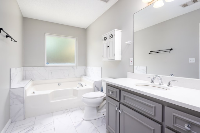 232 Mill Pond Dr, Phenix City, AL 36870 - bathroom featuring a garden tub, vanity, toilet, and marble look tile flooring