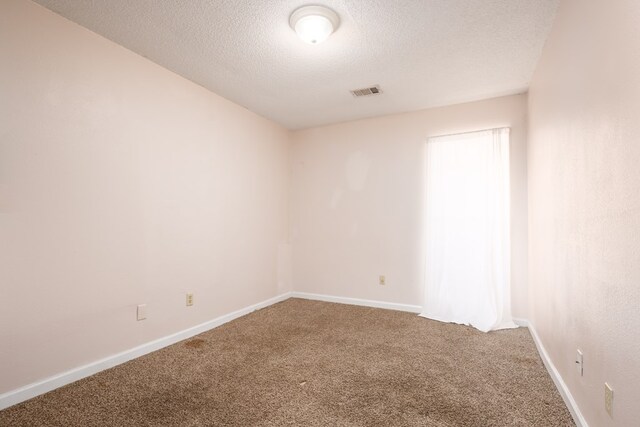232 Mill Pond Dr, Phenix City, AL 36870 - empty room with carpet, a textured ceiling, and baseboards