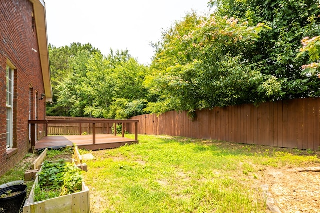 232 Mill Pond Dr, Phenix City, AL 36870 - view of yard featuring a wooden deck and a garden