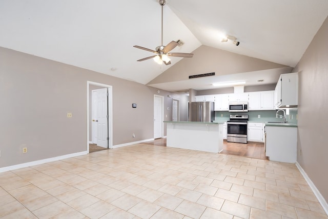 232 Mill Pond Dr, Phenix City, AL 36870 - kitchen featuring stainless steel appliances, a sink, ceiling fan, open floor plan, and a center island
