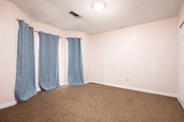 232 Mill Pond Dr, Phenix City, AL 36870 - empty room with carpet, a textured ceiling, and baseboards