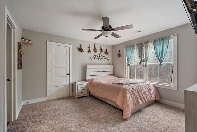 carpeted bedroom with ceiling fan