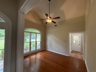 986 Timber Creek Way, Columbus, GA 31904 - empty room with wood finished floors, ceiling fan, and vaulted ceiling
