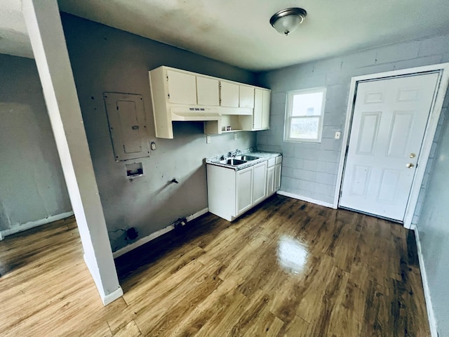 3413 Terminal Ct, Columbus, GA 31906 - laundry area featuring cabinet space, washer hookup, wood finished floors, and electric panel