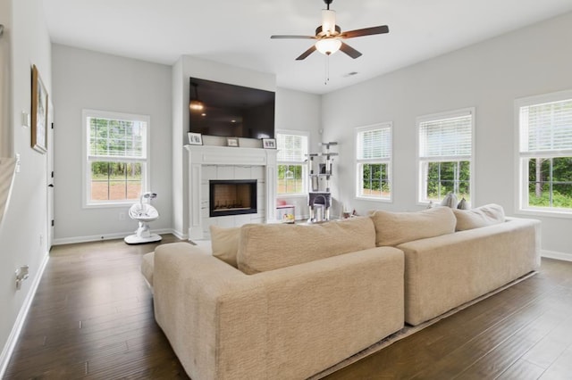 492 Mulberry Crossing Dr, Cataula, GA 31804 - living area featuring dark wood finished floors, a tile fireplace, baseboards, and a ceiling fan