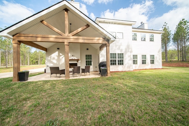 492 Mulberry Crossing Dr, Cataula, GA 31804 - back of house featuring a chimney, a patio area, and a lawn