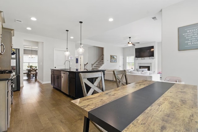 492 Mulberry Crossing Dr, Cataula, GA 31804 - kitchen with dishwasher, a sink, dark wood finished floors, a ceiling fan, and healthy amount of natural light