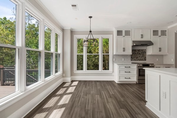 kitchen with electric range, white cabinets, decorative light fixtures, and ornamental molding