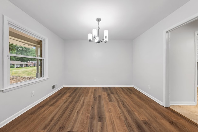 4001 Savannah Dr, Columbus, GA 31907 - empty room with a chandelier and wood finished floors