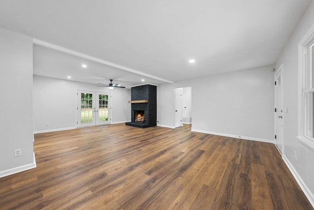 4001 Savannah Dr, Columbus, GA 31907 - unfurnished living room with a fireplace, ceiling fan, recessed lighting, wood finished floors, and french doors