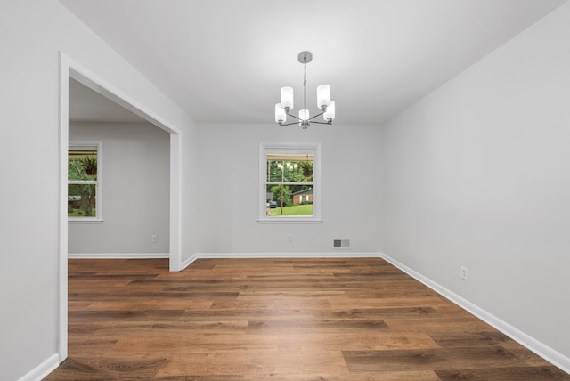4001 Savannah Dr, Columbus, GA 31907 - spare room with a chandelier and wood finished floors