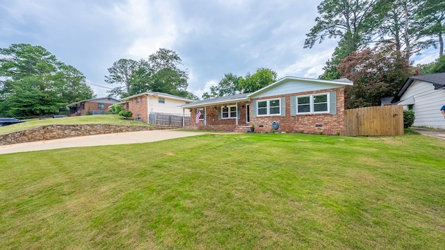 4001 Savannah Dr, Columbus, GA 31907 - view of front of house with brick siding, concrete driveway, and crawl space