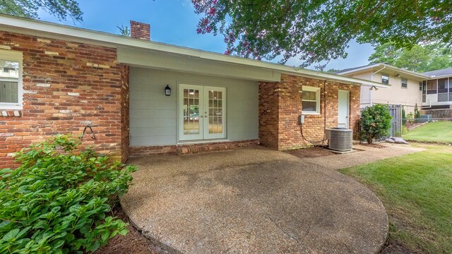 4001 Savannah Dr, Columbus, GA 31907 - property entrance with a chimney, french doors, and brick siding