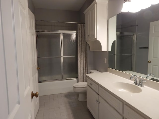 5110 Midland Trce, Columbus, GA 31820 - bathroom with toilet, vanity, tile patterned floors, and combined bath / shower with glass door