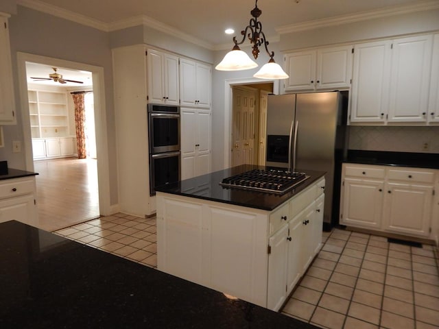 5110 Midland Trce, Columbus, GA 31820 - kitchen featuring stainless steel appliances, light tile patterned floors, dark countertops, white cabinets, and crown molding