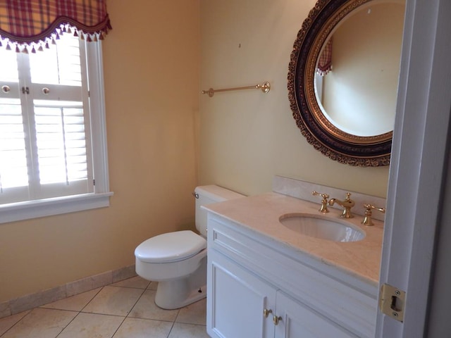 5110 Midland Trce, Columbus, GA 31820 - bathroom with plenty of natural light, toilet, vanity, and tile patterned flooring