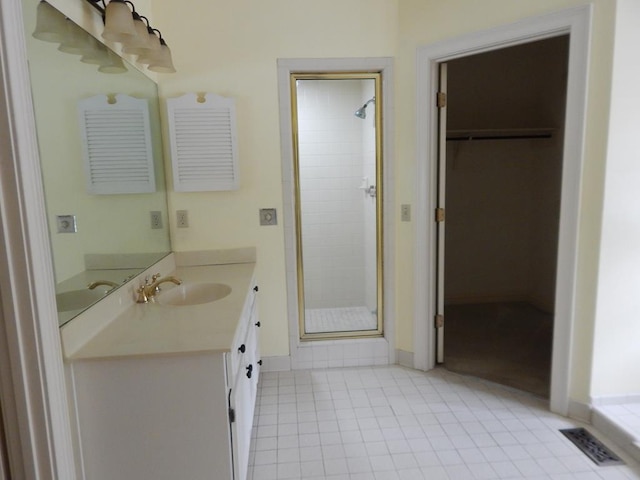 5110 Midland Trce, Columbus, GA 31820 - full bath with a shower stall, vanity, a spacious closet, tile patterned flooring, and baseboards