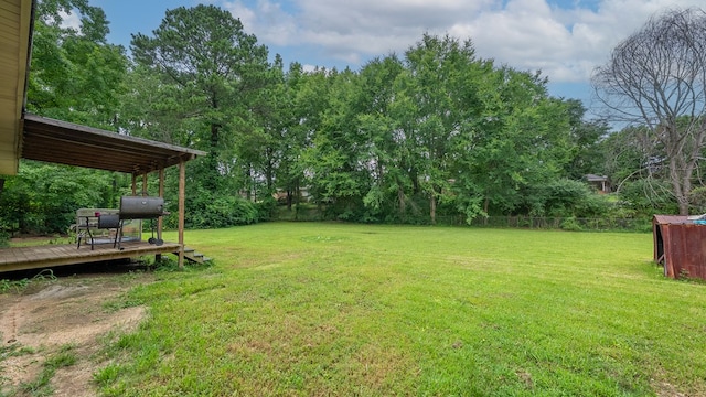 5407 Maltese Dr, Columbus, GA 31904 - view of yard featuring a wooden deck and view of wooded area