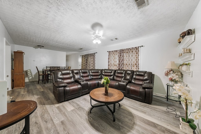5407 Maltese Dr, Columbus, GA 31904 - living area featuring a textured ceiling and wood finished floors