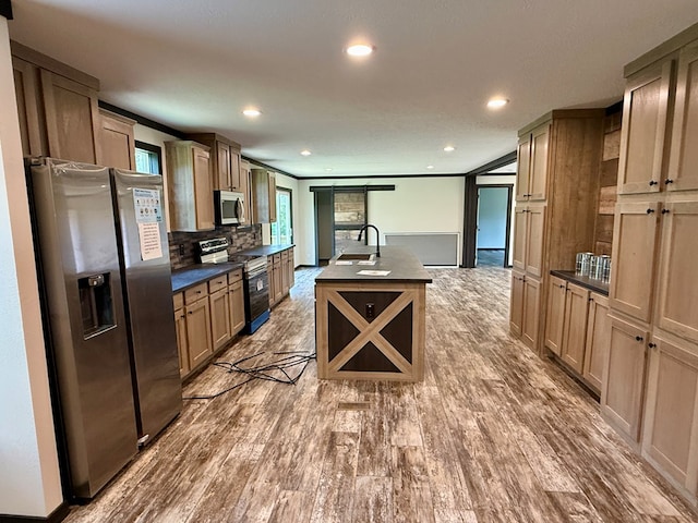 773 Grantham Dr, Cataula, GA 31804 - kitchen featuring appliances with stainless steel finishes, dark countertops, a sink, wood finished floors, and recessed lighting
