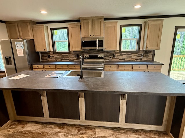 773 Grantham Dr, Cataula, GA 31804 - kitchen with appliances with stainless steel finishes, dark countertops, a sink, decorative backsplash, and recessed lighting