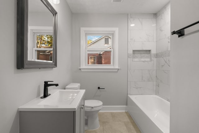 full bathroom featuring tile patterned flooring, vanity, a healthy amount of sunlight, and toilet