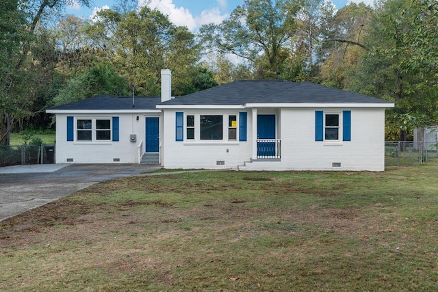 ranch-style home with a front lawn