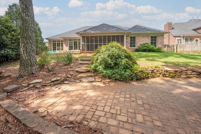7036 Imperial Way, Columbus, GA 31904 - back of house with brick siding, a sunroom, and a patio
