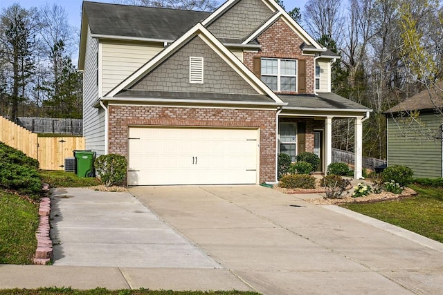 4447 Walking Stick Way, Columbus, GA 31907 - craftsman inspired home with driveway, an attached garage, covered porch, and brick siding