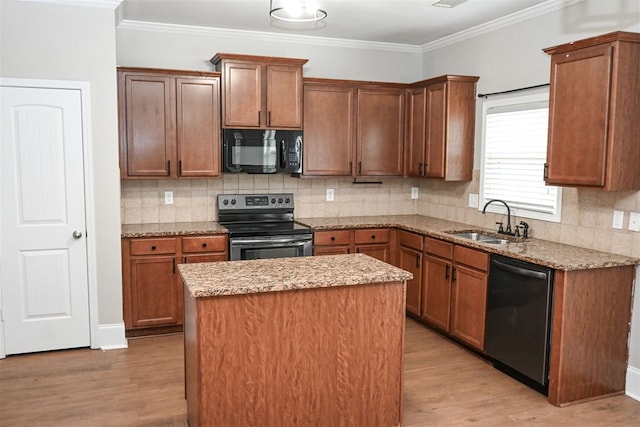4447 Walking Stick Way, Columbus, GA 31907 - kitchen with stainless steel appliances, light wood-style flooring, a center island, backsplash, and crown molding