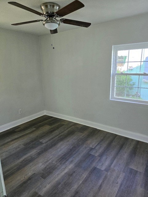 empty room featuring dark wood-type flooring