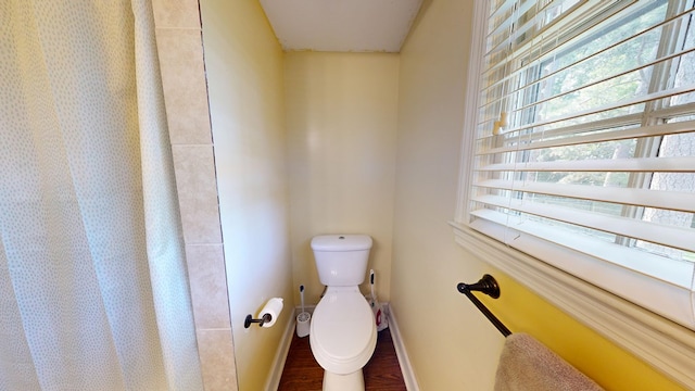 4042 Lyn Dr, Columbus, GA 31909 - full bathroom featuring wood finished floors and a shower with curtain