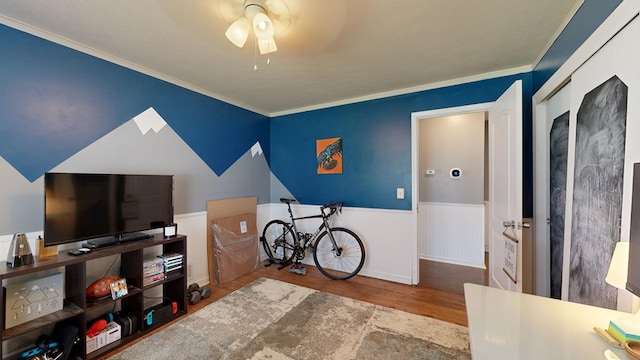 4042 Lyn Dr, Columbus, GA 31909 - bedroom featuring wood finished floors, wainscoting, ornamental molding, and a ceiling fan