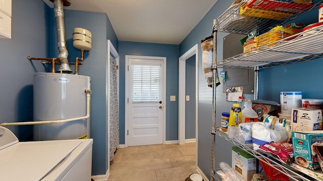 4042 Lyn Dr, Columbus, GA 31909 - washroom featuring washer / clothes dryer, water heater, and light tile patterned flooring