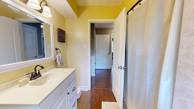 4042 Lyn Dr, Columbus, GA 31909 - bathroom with wood finished floors, vanity, and a shower with curtain