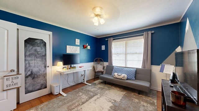4042 Lyn Dr, Columbus, GA 31909 - living room with wood finished floors, ceiling fan, ornamental molding, and a wainscoted wall
