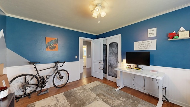 4042 Lyn Dr, Columbus, GA 31909 - bedroom featuring wainscoting, wood finished floors, crown molding, and ceiling fan