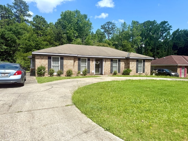 300 Jefferson Dr, Columbus, GA 31907 - single story home with a front lawn, curved driveway, and brick siding