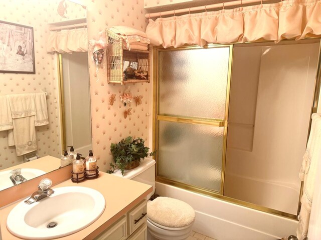 300 Jefferson Dr, Columbus, GA 31907 - bathroom featuring wallpapered walls, vanity, and shower / bath combination with glass door