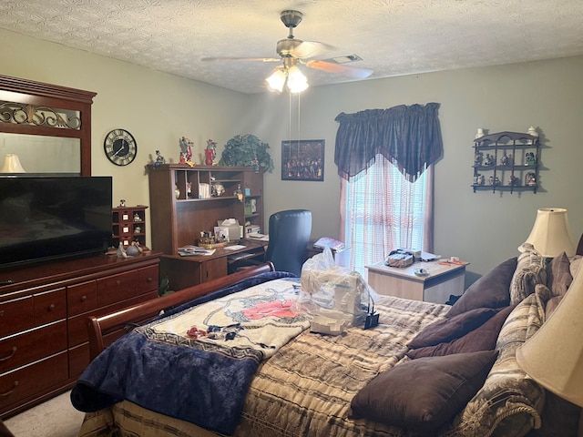 300 Jefferson Dr, Columbus, GA 31907 - carpeted bedroom with a ceiling fan and a textured ceiling