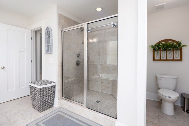 bathroom with a shower stall, tile patterned flooring, baseboards, recessed lighting, and toilet