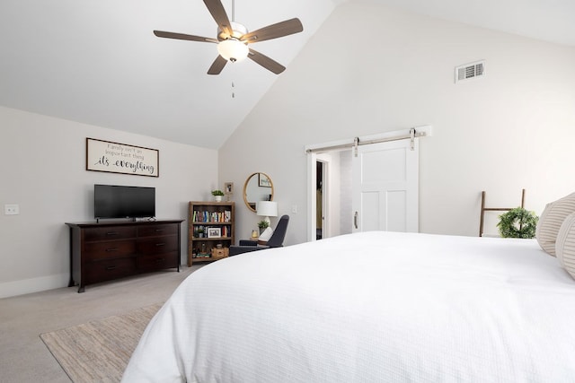 bedroom with high vaulted ceiling, carpet flooring, a barn door, ceiling fan, and baseboards