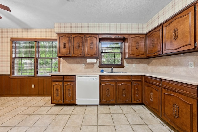 1818 Springvalley Dr, Columbus, GA 31904 - kitchen with white dishwasher, light countertops, a textured ceiling, wainscoting, and a ceiling fan
