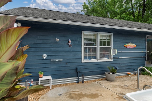 3264 Columbus Hwy, Box Springs, GA 31801 - view of side of home featuring a patio and roof with shingles