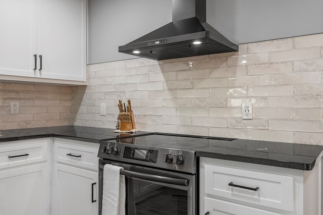 3264 Columbus Hwy, Box Springs, GA 31801 - kitchen with wall chimney exhaust hood, electric range oven, white cabinets, decorative backsplash, and dark stone counters
