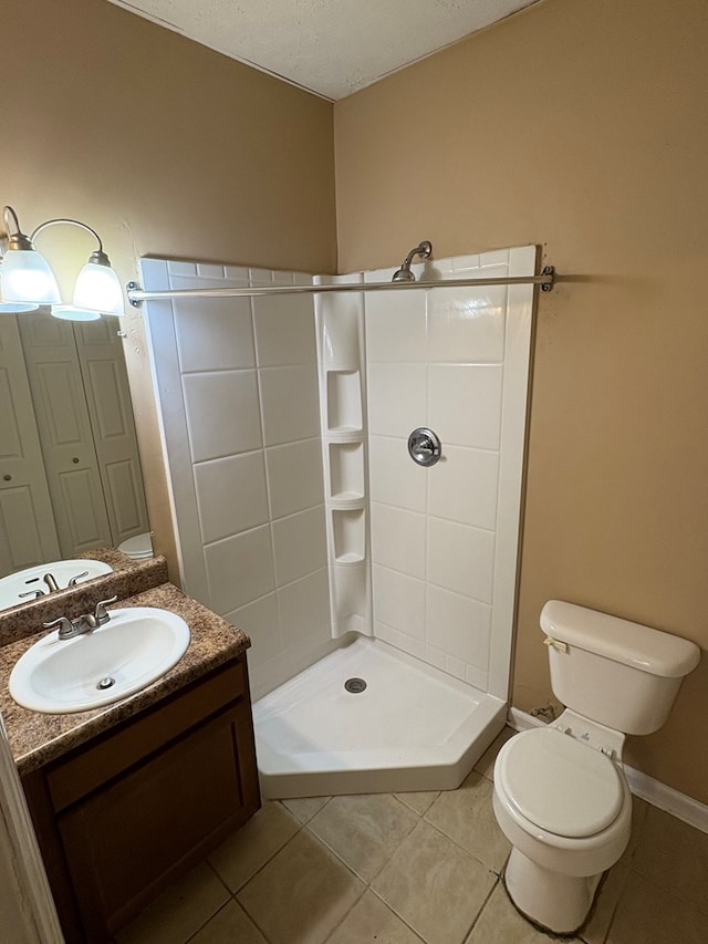 full bath with tile patterned flooring, toilet, vanity, and a shower stall