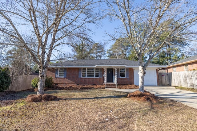 single story home featuring crawl space, brick siding, fence, and concrete driveway