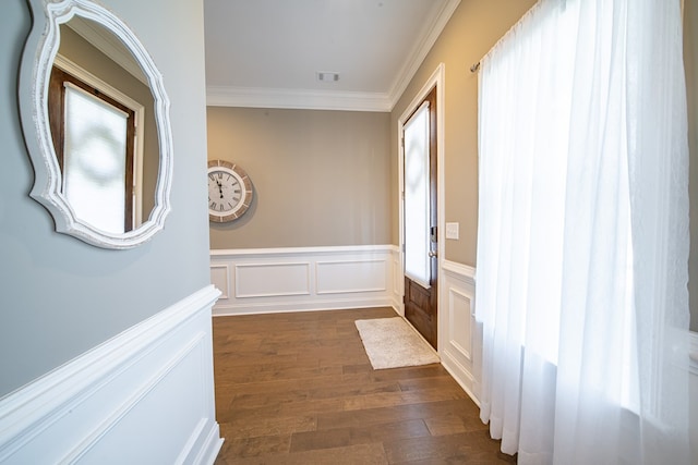 corridor featuring a wealth of natural light, dark hardwood / wood-style flooring, and ornamental molding